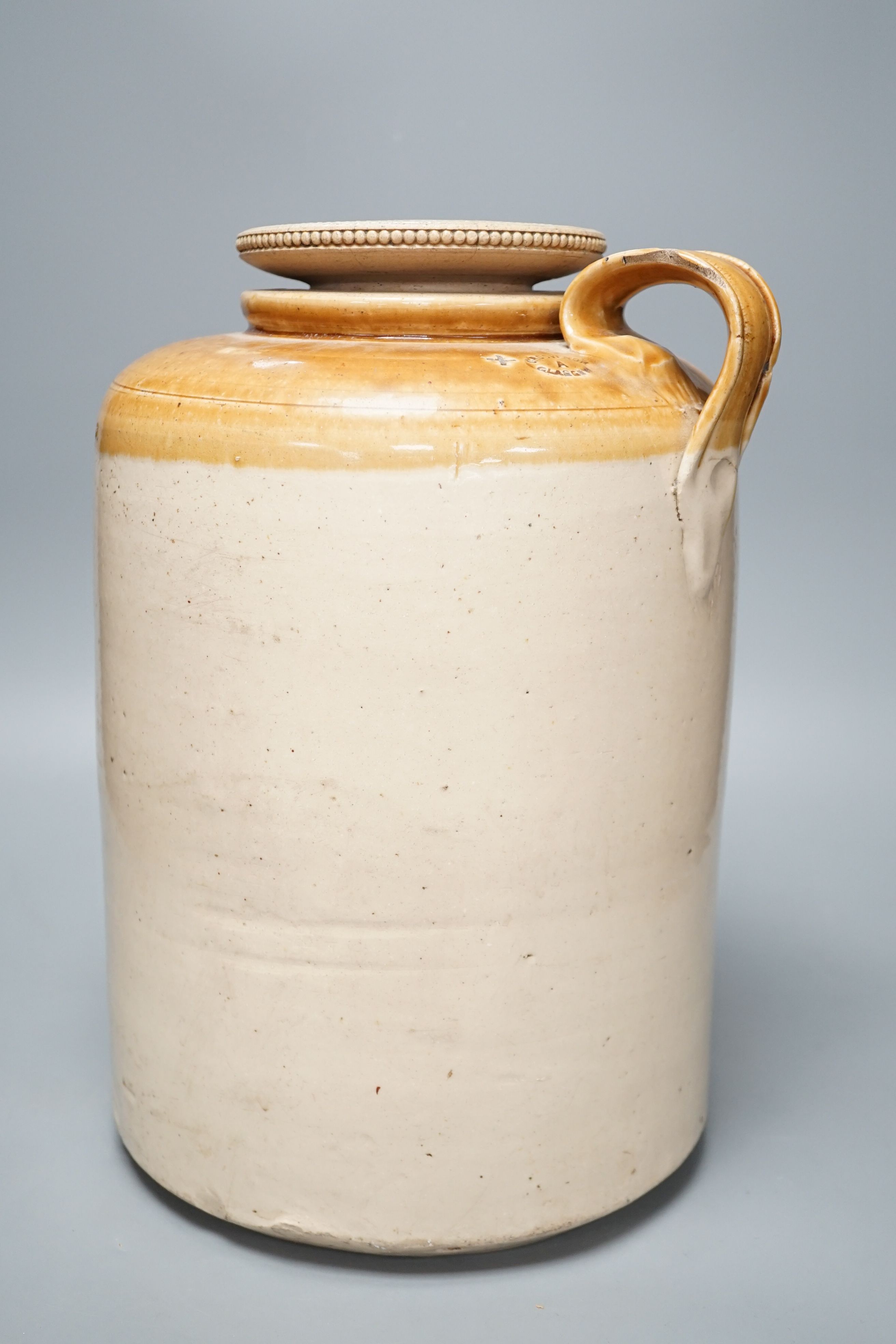 A Grosvenor Glasgow stoneware beer, storage jar, 37 cms high.